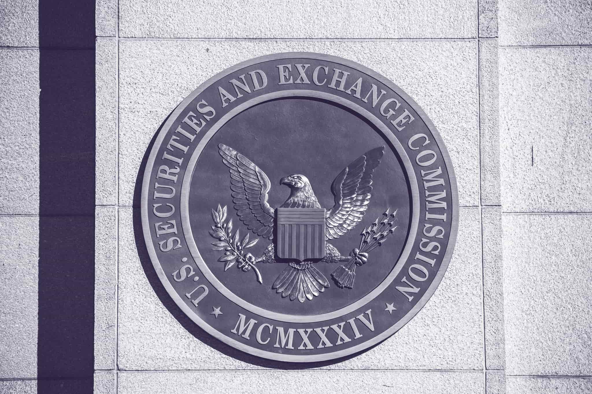 A sign on a building reads "U.S. Securities and Exchange Commission" and displays the seal of the United States.